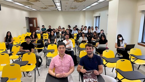 Speaker has a group photo with Colin Cheng and students